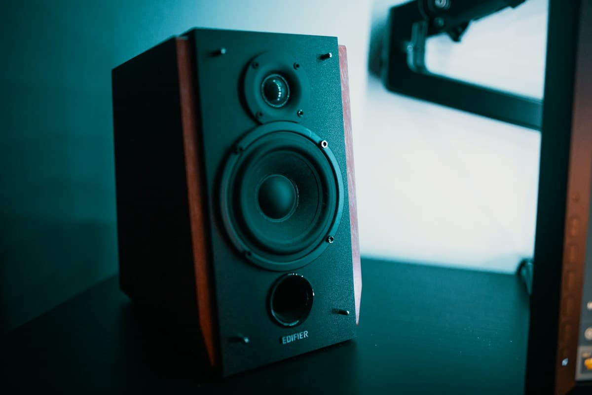 Cube Speaker on Wooden Workspace